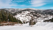 Snow is melting fast in snowy countryside landscape nature in end of winter season. Early spring Time lapse
