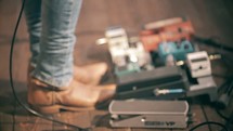 cowboy boots and guitar foot pedals 