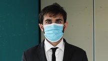 a businessman wearing a face mask 