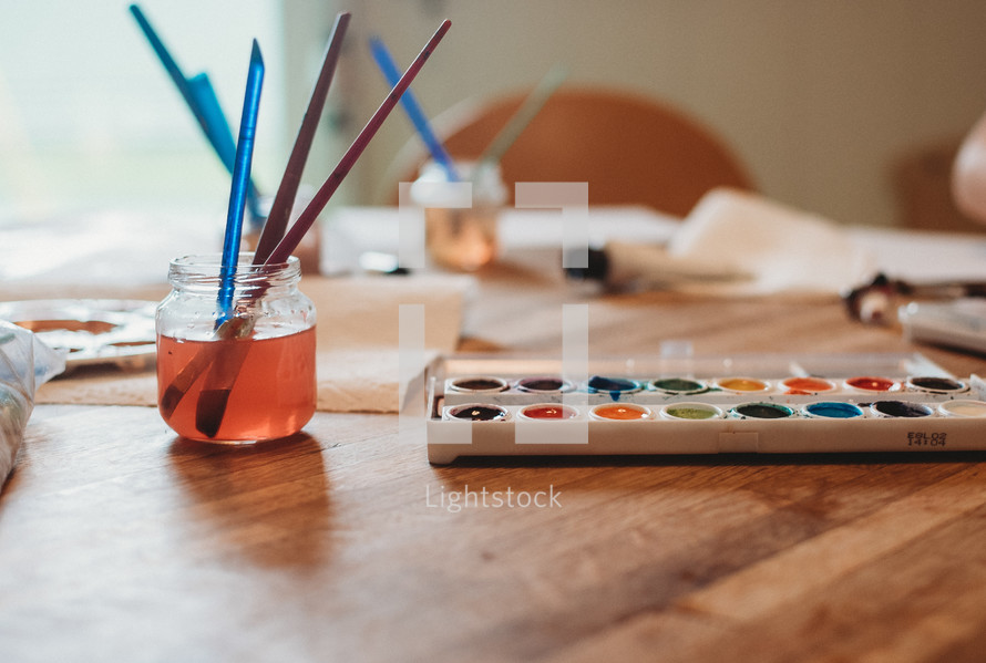 watercolor paints on a table 