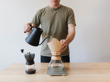 a man slow brewing coffee