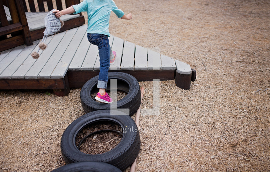 girl playing on a playground 