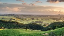 Beautiful sunny evening light over rural country at sunset in summer nature in New Zealand Time-lapse
