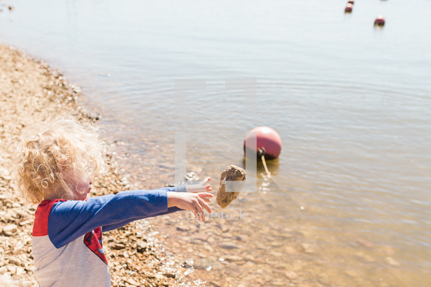 a child skipping rocks 