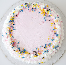 icing and sprinkles on a cake 