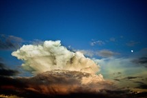 towering clouds in the sky at sunset 