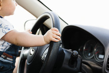 toddler at the steering wheel 