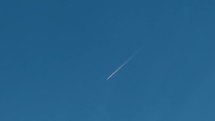 Airplane trail in the blue sky 