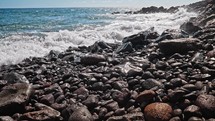 Pacific ocean view, seascape, water surface, ripple, little waves on pebble beach. Universal nature, resort, summer vacation nature background. High quality 4k footage