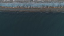 aerial view over a winter shoreline 