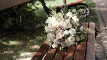 bridal bouquet on a bench 