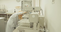 Scientist working in a pharmaceutical laboratory conducting experiments