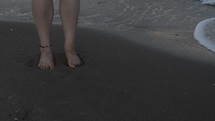 standing on a beach 