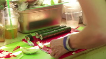 a woman making sushi 