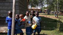 children drinking water at an orphanage 