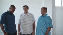 a group of men talking 