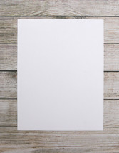 blank white paper on wood boards 