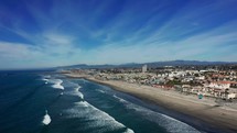 Drone flying over the Oceanside, California coastline.