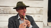 a man playing a flute 
