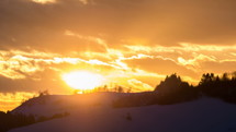 Golden sunset over landscape Time lapse
