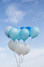 blue and white helium balloons 
