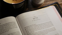 Focus Rack Pull on Bible Open to Acts