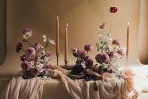 candlesticks and mauve flowers 