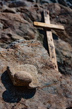 cross and stacked rocks 