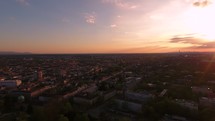 aerial view over a city at sunset 