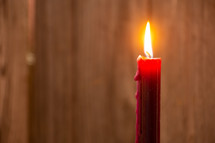 red candle with flame 