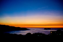 shoreline silhouette at sunset 
