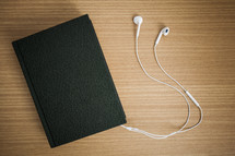 Bible and earbuds 