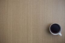 coffee mug on a wood table 
