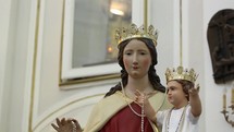 statue of Mary and baby Jesus coming into focus 