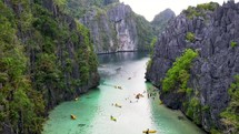 Kayakers in a lagoon in the Philippines