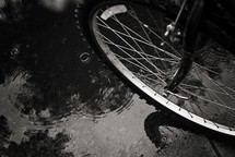 bicycle tire in a puddle 