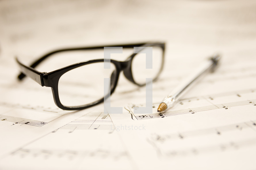 sheet music and reading glasses