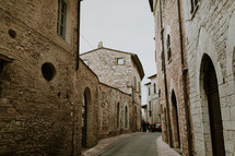 a narrow street between buildings 