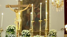 crucifix at an altar coming into focus 