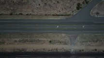 aerial view over a desert landscape and highway 