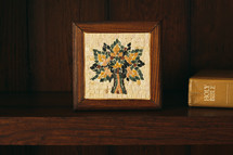 tile mosaic from Jordan and Bible on a bookshelf 