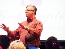 A Pastor teaching at a evening bible study class. 