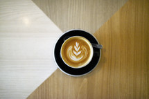 design in creamer in a latte 