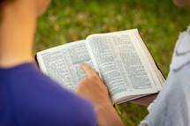 boys reading scripture together 