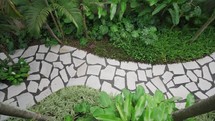 Top down house garden with beautiful rock path
