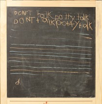 A chalk board with the phrase 'Don't talk potty talk' written on it