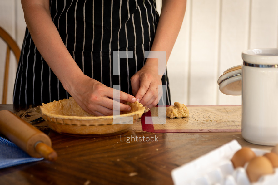 a woman baking a pie for July 4th 