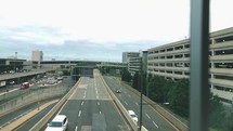 cars approaching an airport terminal 