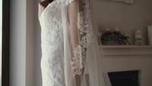 bride standing in her wedding gown 