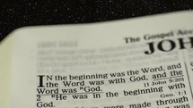 The Bible, John 1:1 with star background